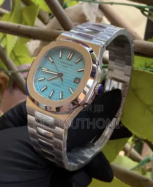 Automatic Stainless Steel Patek Philippe Nautilus Turquoise Blue Dial.