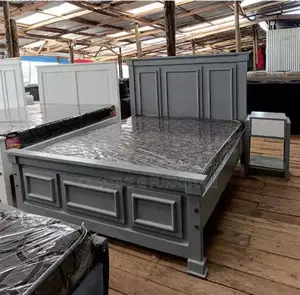 An Elegant Queen Sized Wooden Bed