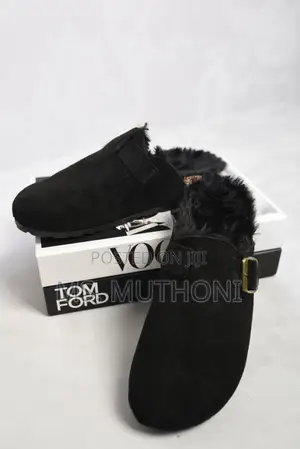 Black Suede Clogs With a Fur Lining and Buckle Detail,