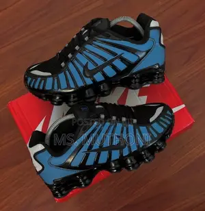 Color Change Nike Shox Tl Men's Shoe in a Black and Blue Colorway.