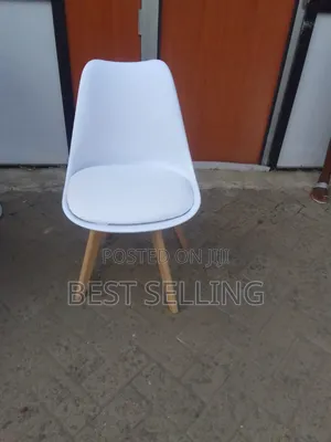 White Padded Eames Chairs