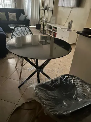 Dark Clear Coffee Table and Black Mesh Eames Chairs