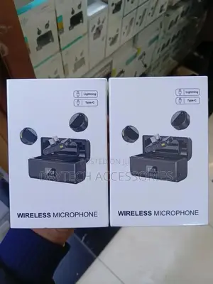 Dual Wireless Lavalier Microphone System With a Charging Case.