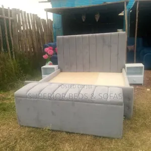 Upholstered Bed Size 5 by 6 + Ottoman.