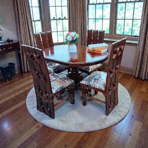 Dining Set an Oval Shaped Wooden Dining Set With a Smooth Finish