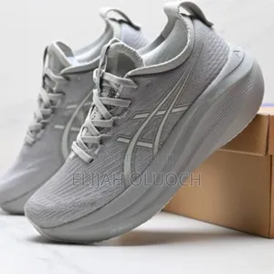 Asics Gel-Nimbus 27 Running Shoes in a Light Grey Colorway.