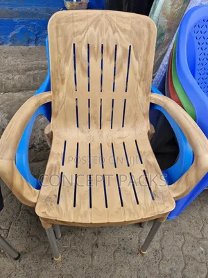 Brown Modern Plastic Chair W/ Metal Tubing Legs.