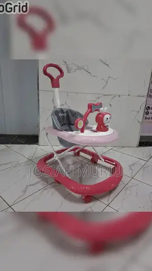 Baby Walker With a Push Handle and Built-in Music and Toys.