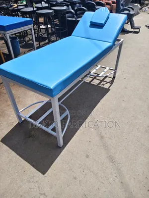 Massage Bed With Navy Blue and White Paint on Frame