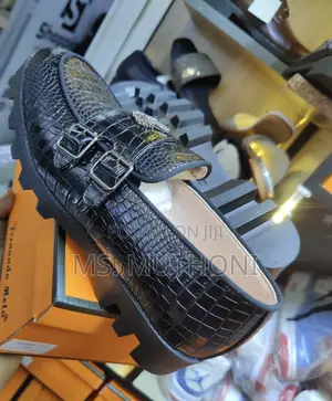 Crocodile-Textured Double-Monk Strap Loafers With a Chunky Lug Sole.