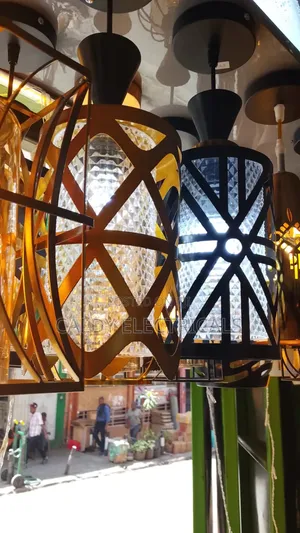 Modern Glass and Metal Pendant Lights With a Caged Design