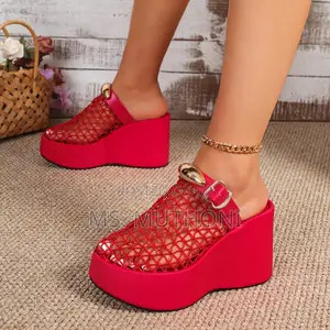 Breathable Woven , Bold Sculpted Platform Sole, and a Golden Accent