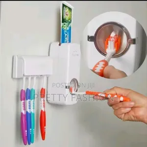 Toothpaste Dispenser and Toothbrush Holder