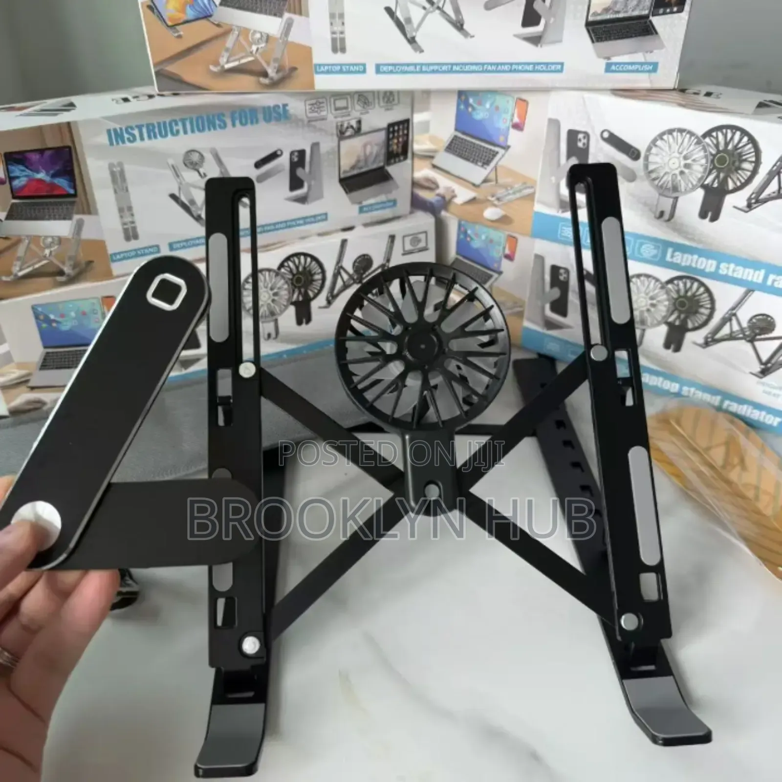 Adjustable, Foldable Laptop Stand With a Built-in Cooling Fan.