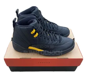 Nike Air Jordan 12 Retro "Black Taxi" Sneakers.