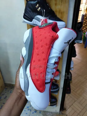 Air Jordan 13 Retro "Red Flint" Sneakers.