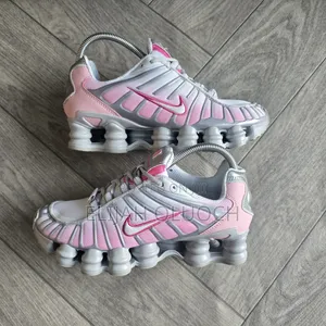 Nike Shox Tl Sneakers In A Metallic Silver And Pink Sneakers