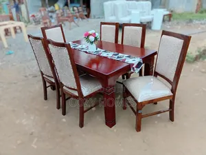 Dining Set a Wooden Dining Table With Semi Matching Upholstered Chairs