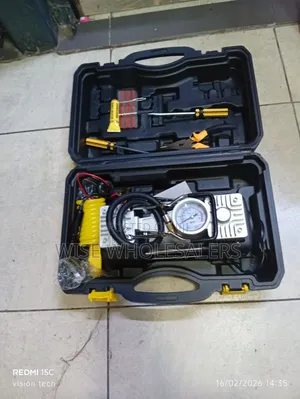 Portable Double Cylinder Car Air Compressor and Tire Repair Kit.