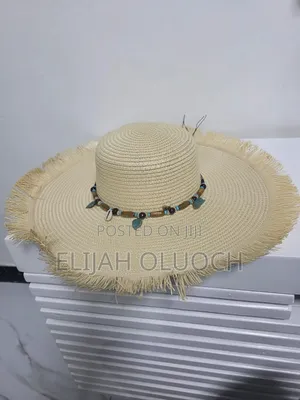 Straw Sun Hat Is Styled With A Beaded Hatband