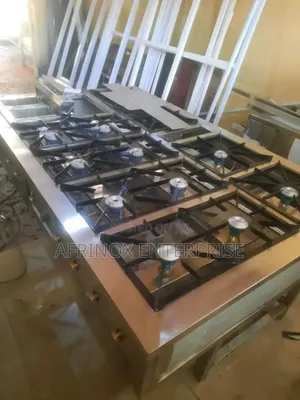 12 Burners Commercial Gas Cooker With a Deep Fryer Machine.