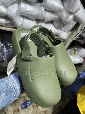 Nike Calm Mules and Slides