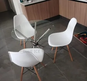Glass Table With White Eames Chair