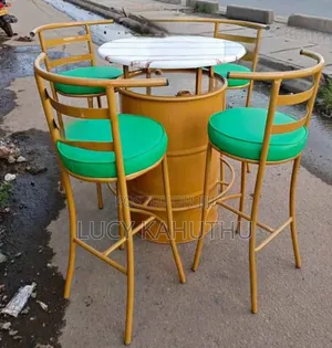 Gold Drum Marble Top Table With Flat Chairs