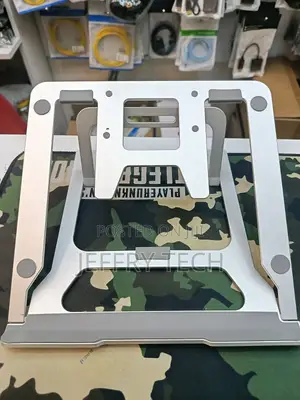 Adjustable Foldable Aluminum Stand Designed for Laptops and Tablets.
