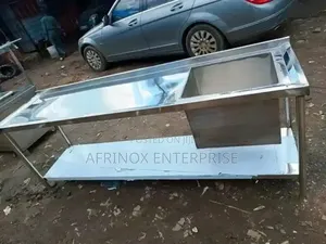 Stainless Steel Work Table With an Integrated Sink.