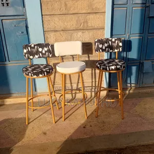 Off White and Black and White Chairs With Powder Coated Finish