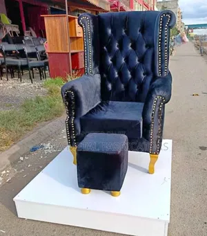 Pedicure Chair With a White Platform and Matching Stool.
