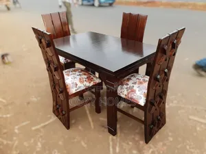 A Wooden 4 Seater Dining Set Dining Set Built With a Balanced Design