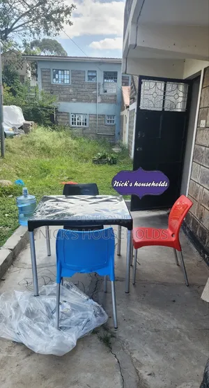 Black Plastic Table With 3 Plastic Chairs