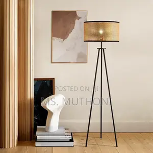 The Rattan Glow Tripod Floor Lamp