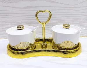 2-Piece Ceramic Sugar Dish Set With a Golden Stand.