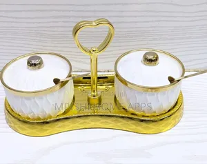 2-Piece Ceramic Sugar Dish Set With a Golden Stand.