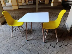 White Square Table With Yellow Chairs