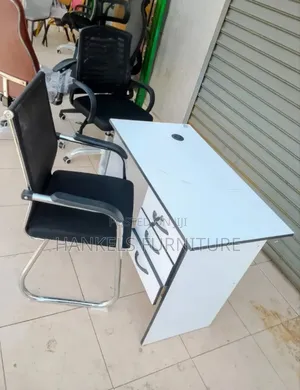 White Desk and Black Mesh Chair