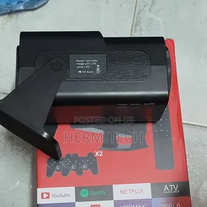 Gaming Projector With Downloaded Games and Two Gaming Consoles