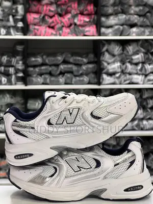 New Balance 530 Trainers in a White and Blue Colorway.