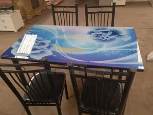 Dinning Table With Blue Floral Tableclothe With Chairs