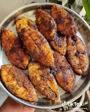 Pan Seared Kingfish Slices Served With French Fries and Coconut Sauce