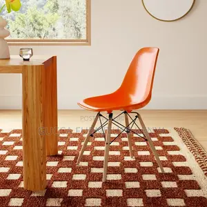 Orange Plastic Armless Eames Dining Chair