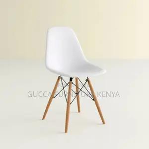 Orange Plastic Armless Eames Dining Chair
