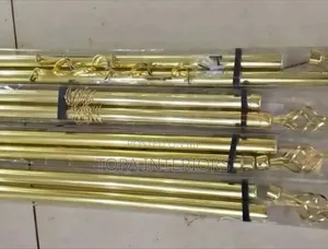 Gold Curtain Rods That Adjust Depending on the Size of the Window