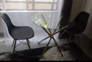 Black Eames Chair With Glass Transparent Table