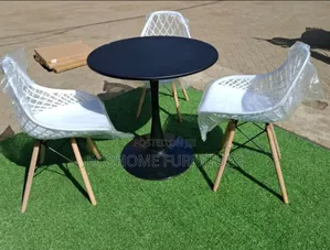 Round Eames Table and Mesh Eames Chairs