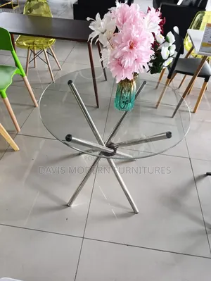 Round Glass Top -Table With a Flower