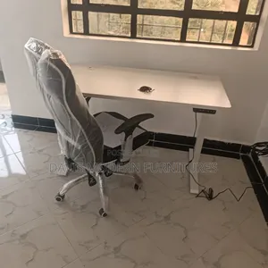 White Rectangular Office Desk With a Matching Chair
